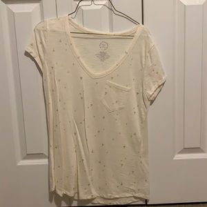 Beige t shirt with gold accents